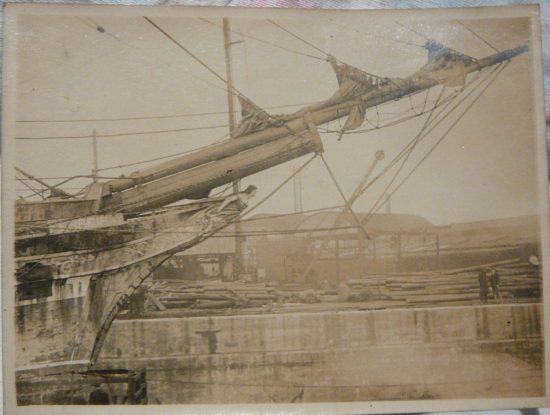 Starboard bow. 'Ferreira' clearly evident, plus missing figurehead arm consistent with known damage, 1918/19